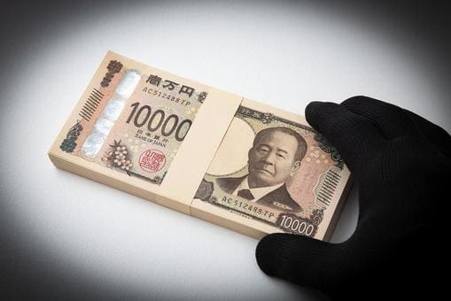 札束と怪しい手